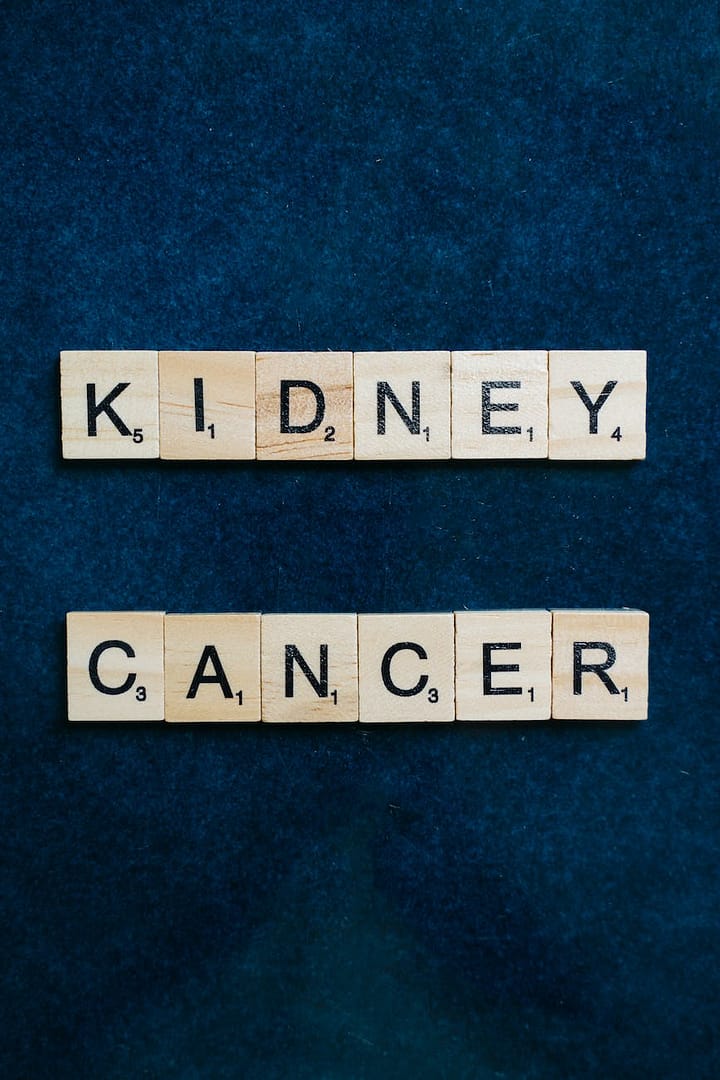 kidney cancer spelled with scrabble tiles on a blue surface